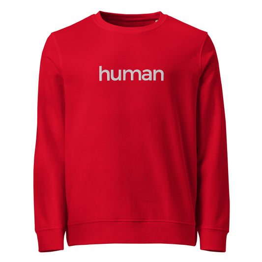 A bright red crewneck sweatshirt with the slogan 'human' printed in white across the chest.