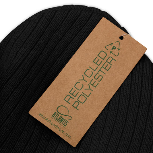 up close image of black ribbed knit beanie with product details on a brown label