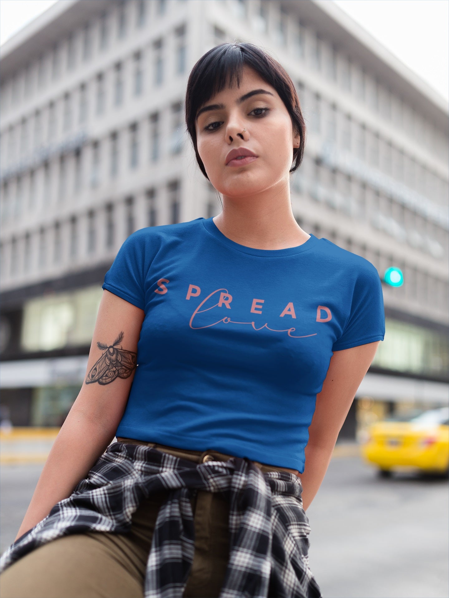 beautiful woman_ in the city wearing royal blue spread love t-shirt