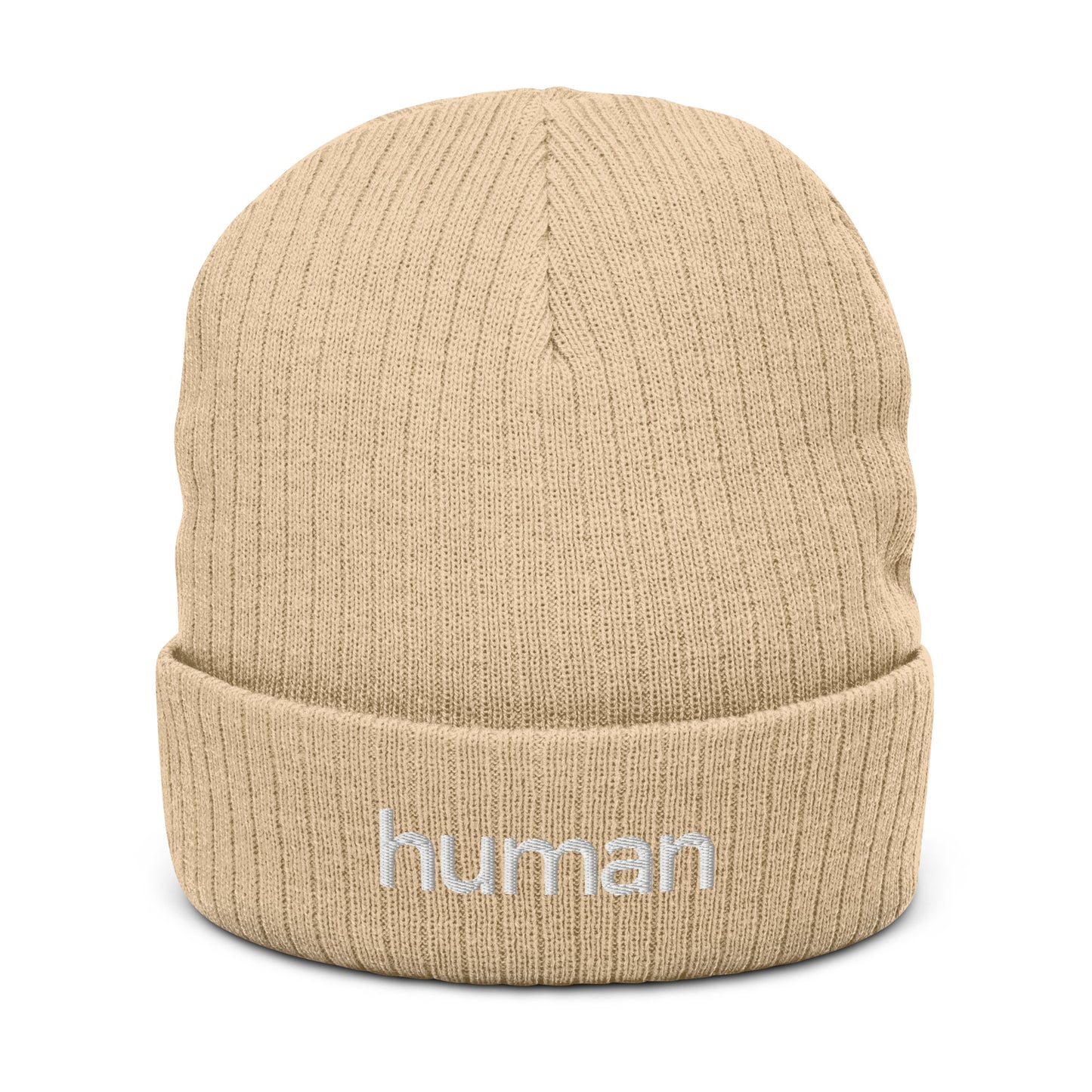 A beige ribbed knit beanie with the word 'HUMAN' written on the fold.