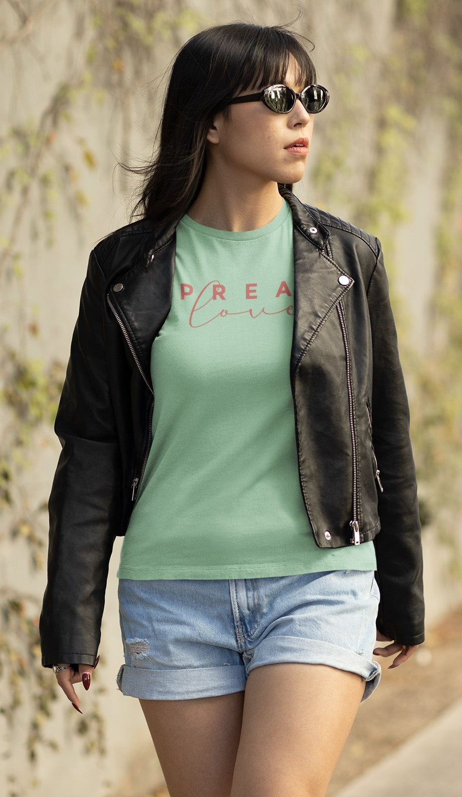 cool woman walking down the street wearing mint spread love_t-shirt