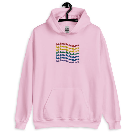 A light pink hoodie with the text 'All Love is one love' printed across the front in a colorful, rainbow gradient design.