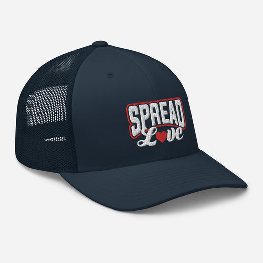 A navy blue trucker cap with a breathable mesh back, featuring the text 'SPREAD LOVE' in red and a red heart symbol on the front.