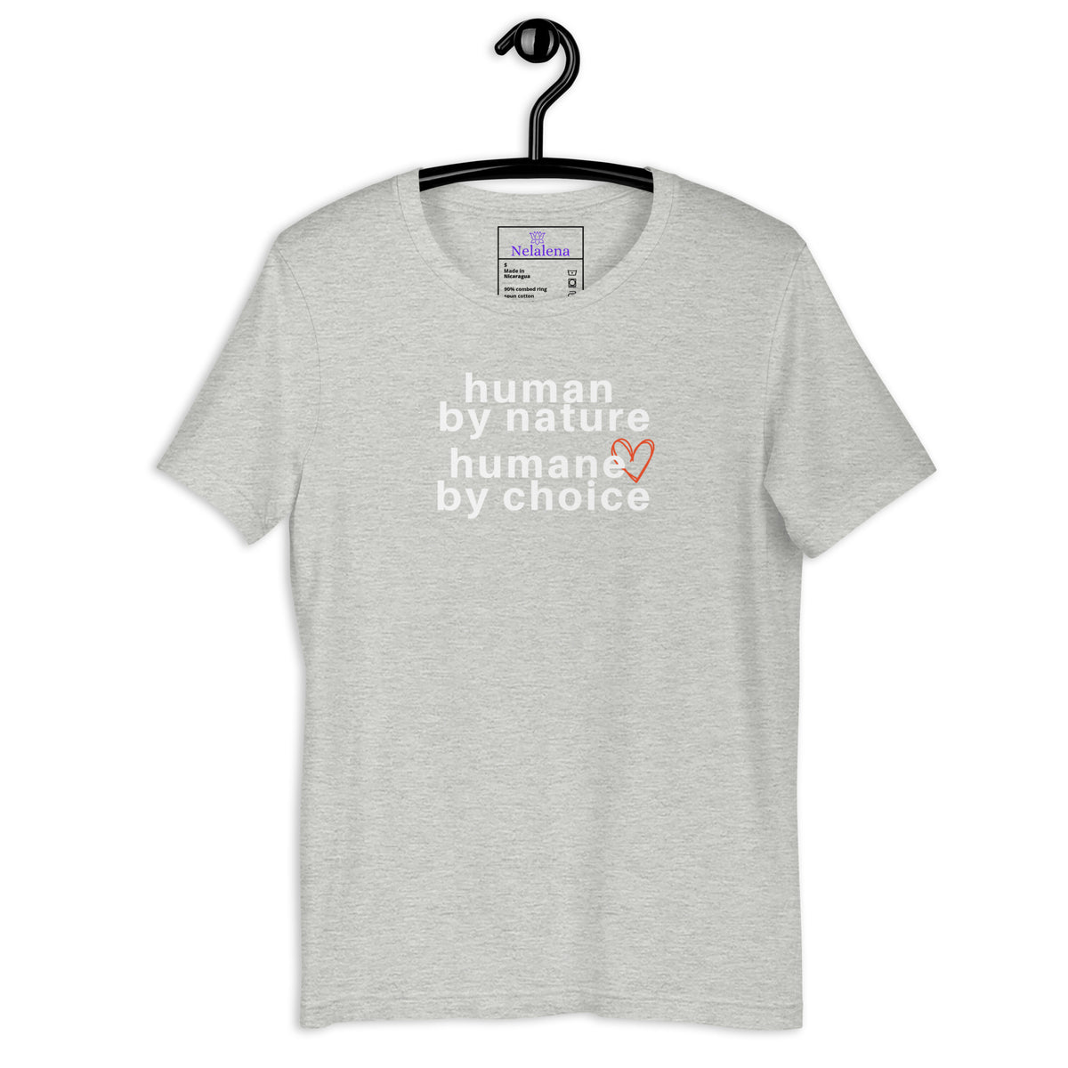 A light gray short-sleeve t-shirt hanging on a black hanger against a white background, featuring the text 'human by nature humane by choice' in white with a small orange heart accent.