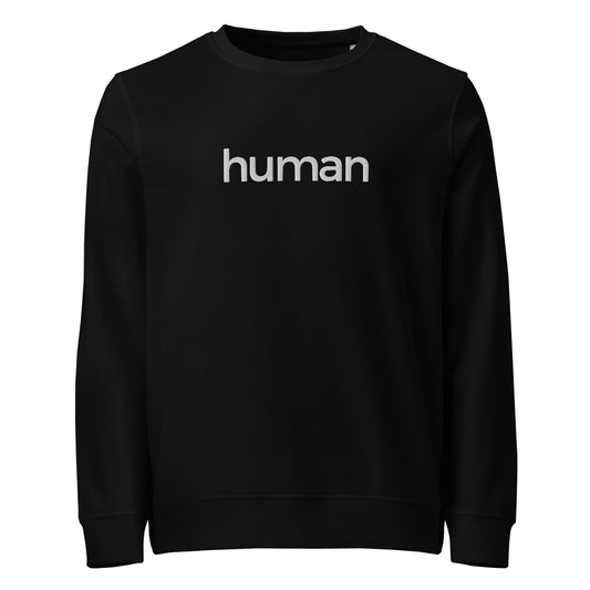 A black crewneck sweatshirt with the slogan 'human' printed in white across the chest.