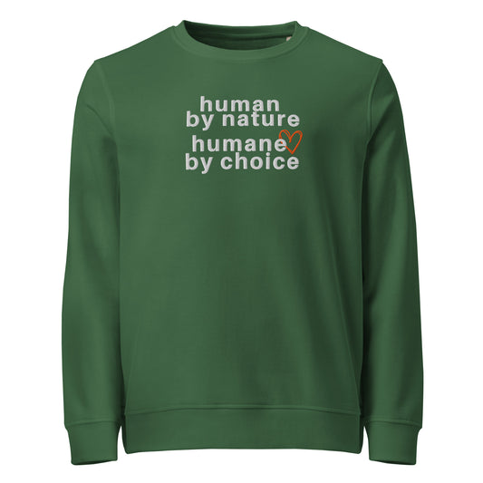 green crewneck sweatshirt with graphic "human by nature humane by choice" with the outline of a heart over the 'e' in humane