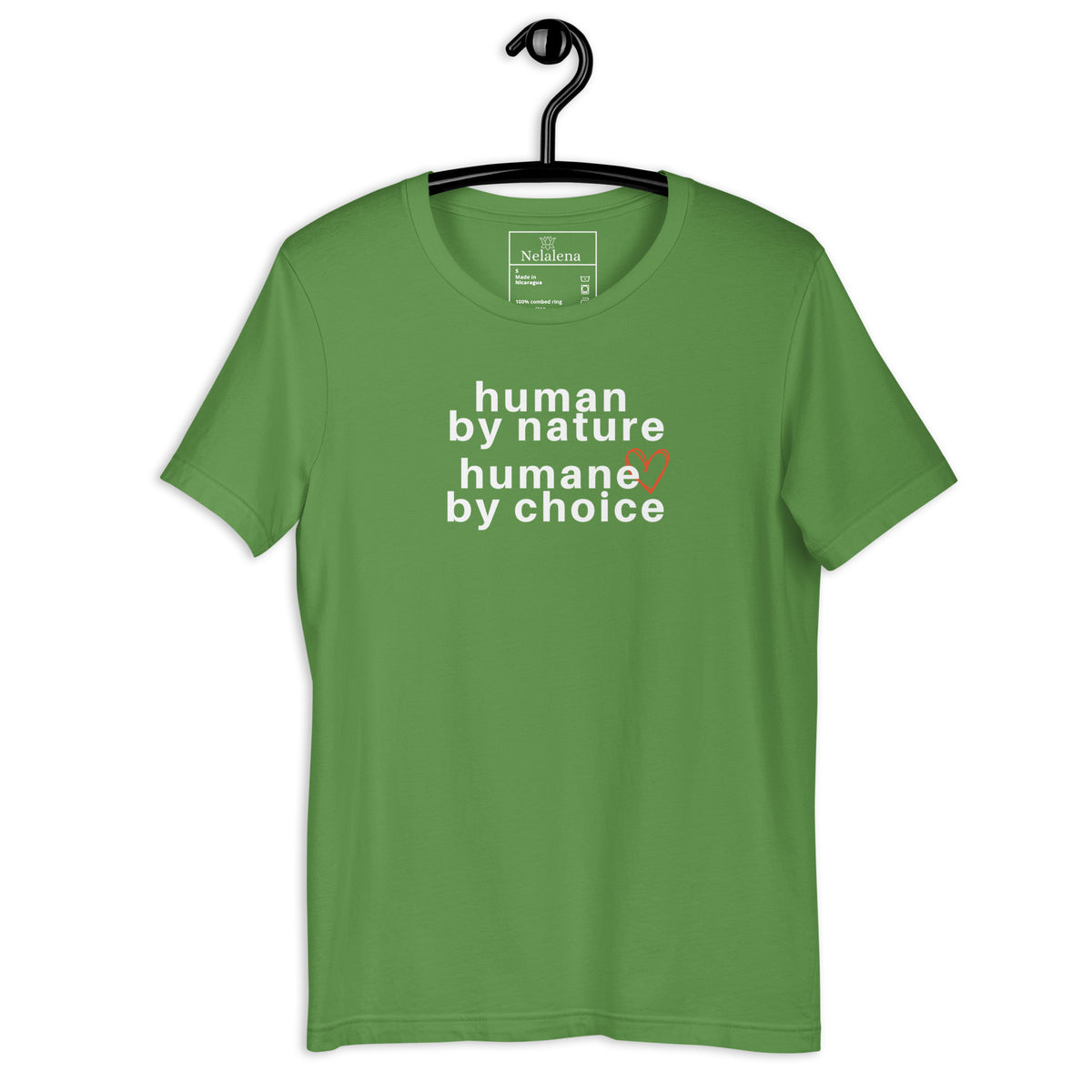 A green short-sleeve t-shirt hanging on a black hanger against a white background, featuring the text 'human by nature humane by choice' in white with a small orange heart accent.