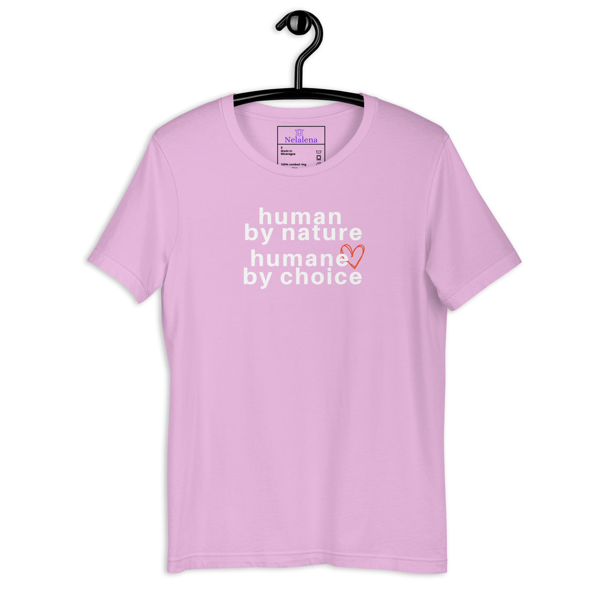 A pink short-sleeve t-shirt hanging on a black hanger against a white background, featuring the text 'human by nature humane by choice' in white with a small orange heart accent.