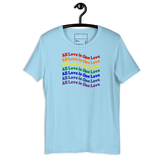 A light blue short-sleeve t-shirt hanging on a black hanger against a white background. The front of the shirt features a graphic print of the phrase 'All Love is One Love' repeated in a rainbow color gradient.