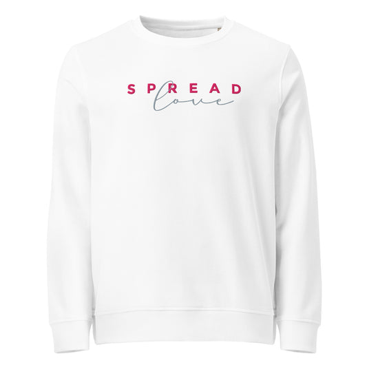 A white crewneck sweatshirt featuring the text 'SPREAD love' printed across the chest, with 'SPREAD' in pink block letters and 'love' in a light blue cursive script.