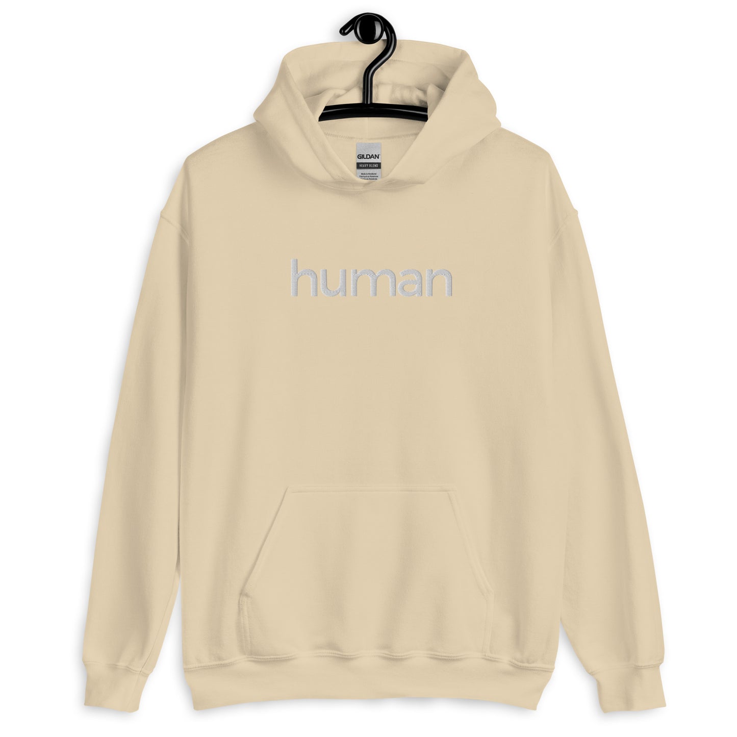 sand colored hoodie with "human" printed on front in white