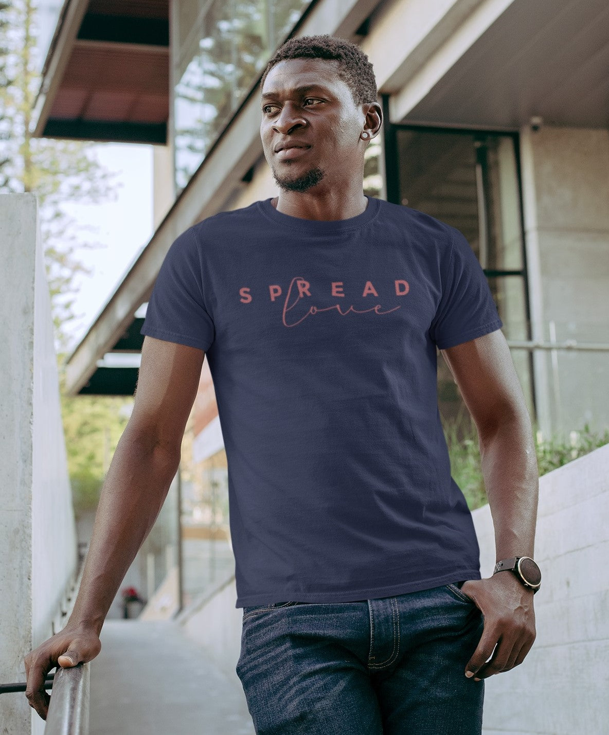 serious looking man wearing navy spread love t-shirt