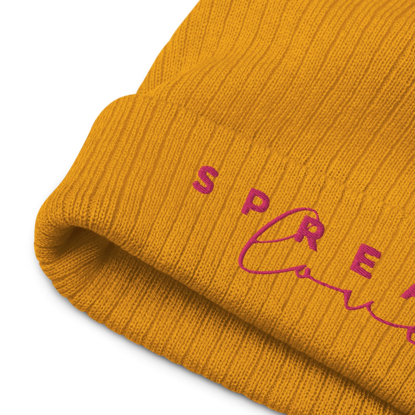 A mustard yellow ribbed knit beanie with the word 'Spread Love' written on the fold.