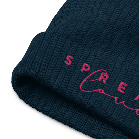 A navy blue ribbed knit beanie with the word 'Spread Love' written on the fold.