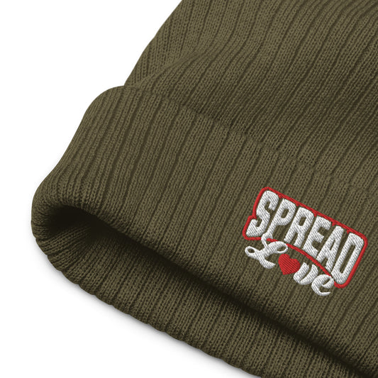 olive green  ribbed knit beanie with "spread love" white text written on the fold 